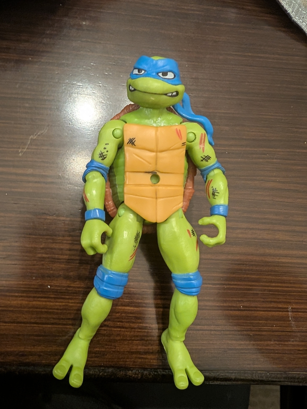 Green and Blue Turtle Action Figure with Orange Shell